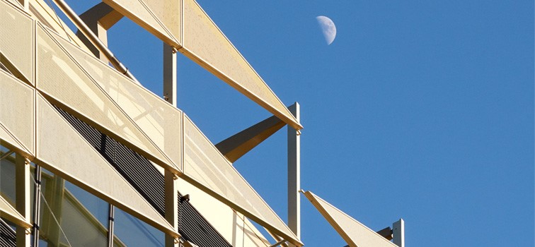 Central Bank of Ireland Gold metal facade building with a blue sky